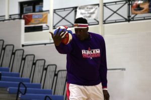 A Harlem Wizard player shows off his skills during pre-game introductions. The Harlem Wizards travel around the world to help raise money for various charities.