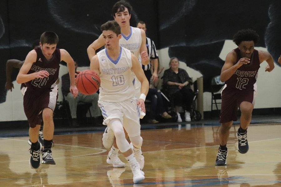 A Panther player runs a fast break against Heard County. The Panthers turned 24 turnovers into 34 points in their win over the Braves.