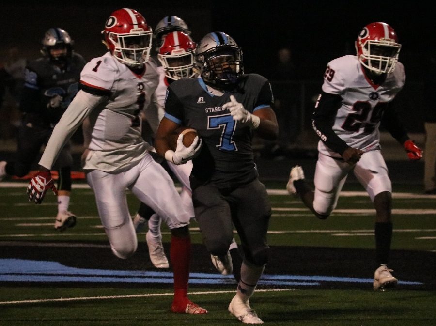 Senior running back Nick Brown races past the Dutchtown defense. Brown rushed for 46 yards and a touchdown, and also broke off an 89-yard kickoff return. 