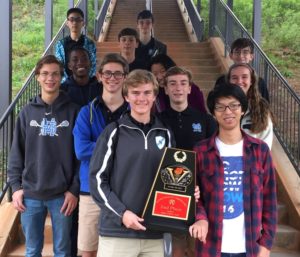 The Varsity Math Team shows off their trophy won at the Thirteenth Annual Rockdale Mathematics Competition. They placed second in team competition and sophomore Brock Spence won the individual round.