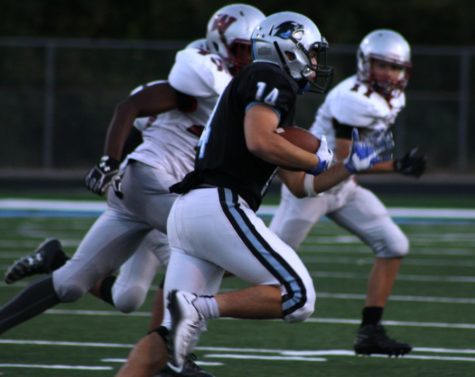 Sophomore running back Ardit Hoti runs the ball against Whitewater. The Mill’s offense was unstoppable defeating the Wildcats 35-0 and maintaining Starr’s Mill perfect record for the season.