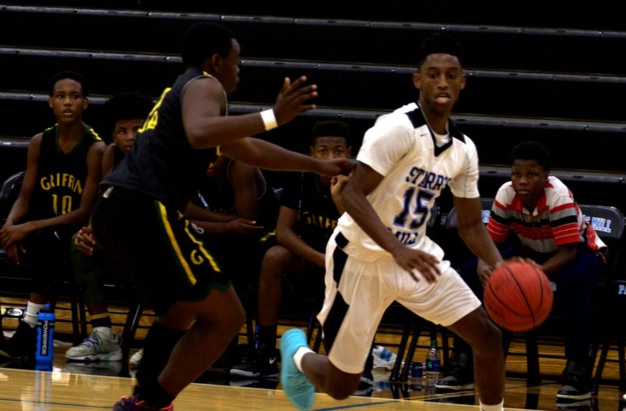 A sophomore player drives to the hoop. The JV Panthers were able to get to the foul line often, allowing for easy points.