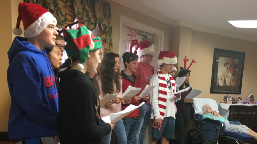 Interact Club members sing “Jingle Bells” to the seniors citizens living at Southland Health & Rehab Center. Interact Club is a leadership club that provides services by bringing the volunteers and community together.