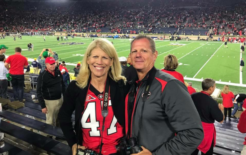 History teacher Jon Gloer and his wife Kathy pose for a photo before the University of Georgia football game against Notre Dame in South Bend, Ind.  This past weekend, the Gloers garnered attention on social media after a Facebook post went viral.