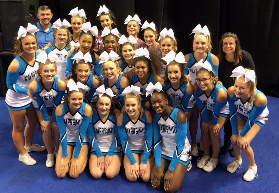 The+varsity+cheer+squad+poses+after+its+performance.+The+Starr%E2%80%99s+Mill+varsity+cheerleaders+placed+3rd+overall+in+the+state+tournament+and+came+close+to+topping+cross-town+rival+McIntosh.