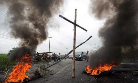 Honduran civilians against incumbent president Juan Orlando Hernandez block roads and start fires throughout the country.