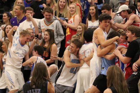 Multiple Panther players celebrate with the student section. The large crowd inside the Panther Pit celebrated the Panthers’ avenging their Dec. 5 loss to the Chiefs.