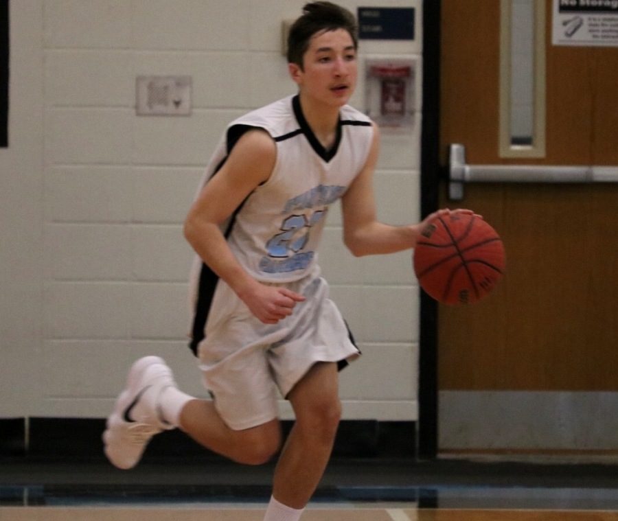 A Panther dribbles the ball down the court. The Mill defeated Whitewater 47-32 in an aggressive rematch game.