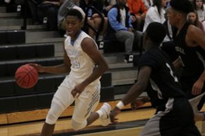 A Panther player dribbles the ball. The boys have now won three games in a row, improving their record to 11-7.