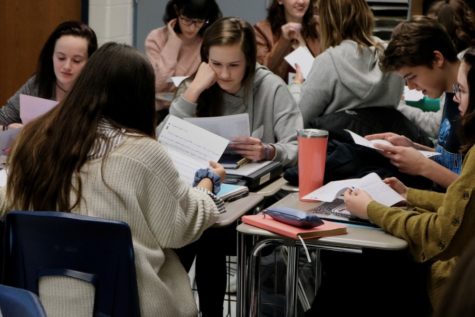 French students open up their pen pal letters from France on the first day back from semester break. Starr’s Mill students sent their letter in French and received their replies in English.