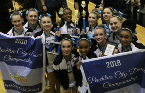The Pantherettes pose with their awards after the Peachtree City Dance Competition. They walked away with a first place award in the junior teen solo division, first place award in small varsity jazz, second place award in small varsity pom, and best choreography. 
