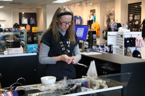 Jan Davis works in the Atlanta Motor Speedway gift shop where she sells merchandise to NASCAR-crazed fans like her. Davis has been a NASCAR fan for 51 years and enjoys when fans come into the gift shop to tell her about “their” driver.