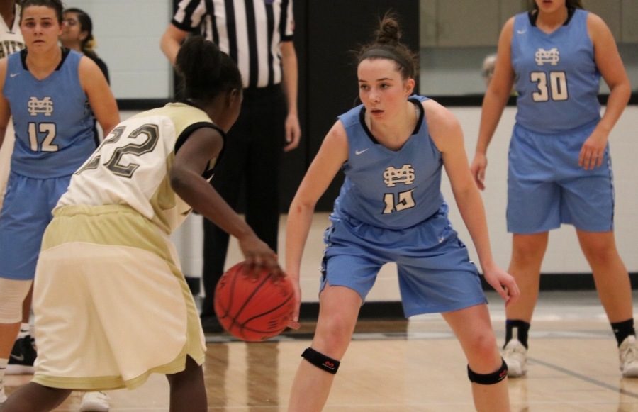 A Lady Panther player defends a Lady Tiger player. The Starr’s Mill defense struggled to contain Fayette County’s shooters, losing to the Tigers 49-39.
