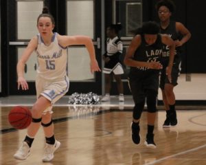 A Panther guard dribbles down the floor during a fast break. The Panthers’ 15 steals contributed to easy fast break baskets. 