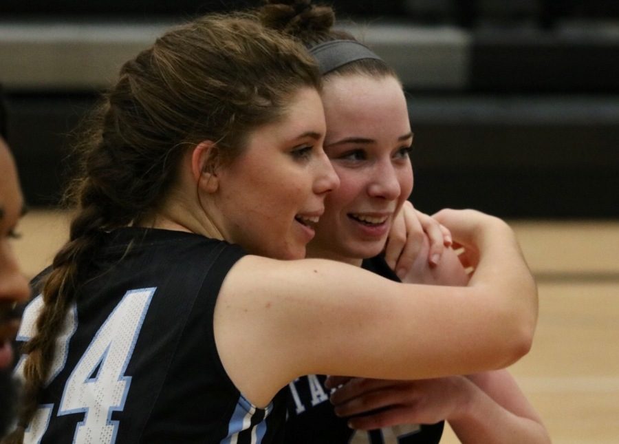 Senior Emily Nieuwstraten and sophomore Alice Anne Hudson embrace following Hudson’s last-second three-pointer that gave Starr’s Mill the 44-42 victory. The win propelled Starr’s Mill to the region championship game against Fayette County.