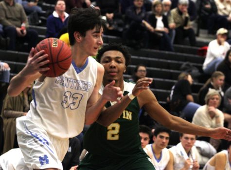 A Panther forward drives past a Griffin defender. The Panthers shot an impressive 21 of 26 from the free throw line in their 27-point blowout of Griffin.