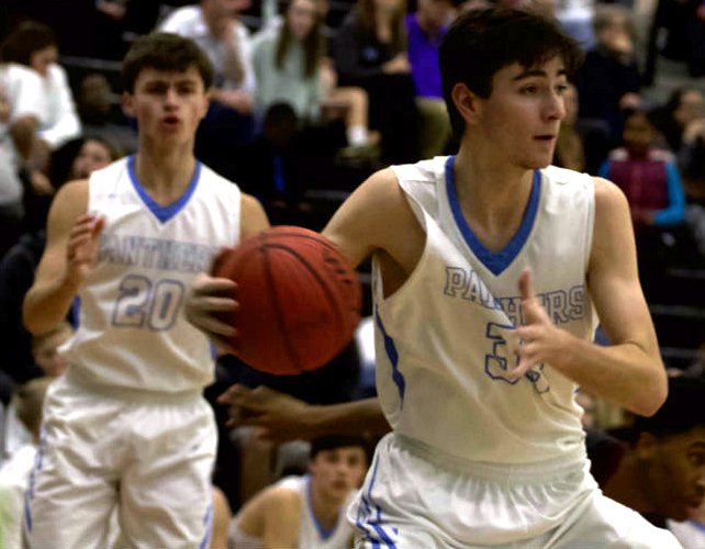 A Panther player grabs a rebound during a game earlier this season. The Panthers’ most recent win over Riverdale set many school records for the basketball program.