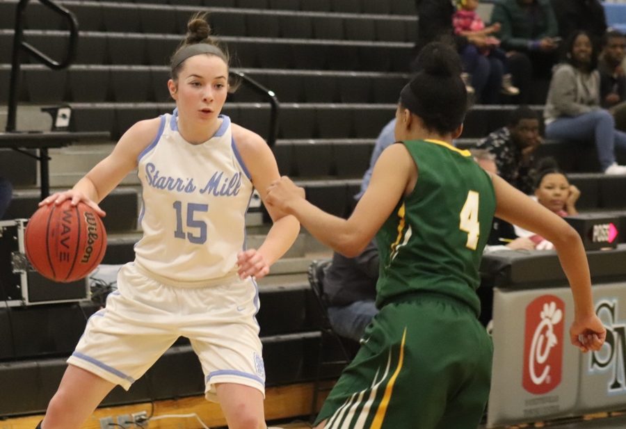 A Lady Panther dribbles down the court while protecting the ball from a visiting Bear. It may have been senior night, but the underclassmen led the Panthers to their final victory of the regular season. 