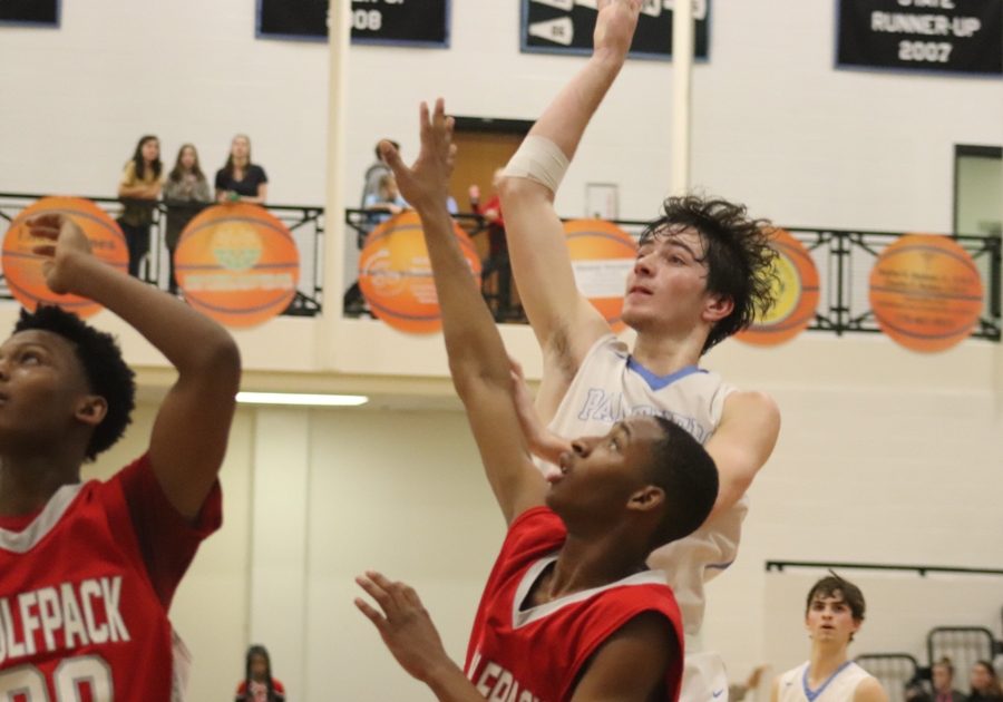 A Panther forward shoots a floater over a Woodland defender. Starr’s Mill was able to get inside the paint at will, drawing fouls and converting at the free throw line.