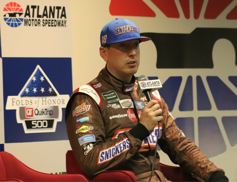 Kyle Busch talks to the media after topping the speed charts in Friday evening's  qualifying session. Busch will lead the field to green after turning a lap of 184.652 mph.