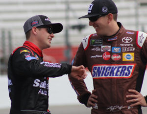 Kyle Busch (right) talks to his teammate Noah Gragson (left) for Kyle Busch Motorsports. Gragson qualified in the top five, with the third fastest lap time of 30.935 seconds, while Busch captured the pole with a time of 30.844 seconds.