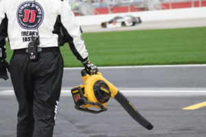 Pit crew member for Kevin Harvick blows off the team’s pit stall after rain delayed the start of the race 2.5 hours. In the No. 4 Jimmy Johns Ford, Harvick dominated the 59th Annual Folds of Honor QuikTrip 500 leading a race-high 181 laps.