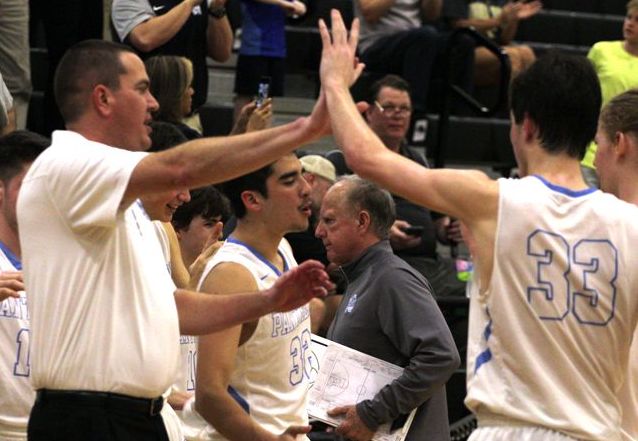 Head coach Brandon Hutchins and all-time leading scorer Drew Hudson high five after finishing the first quarter leading 11-4. The Panthers are in the midst of their longest playoff run in school history.