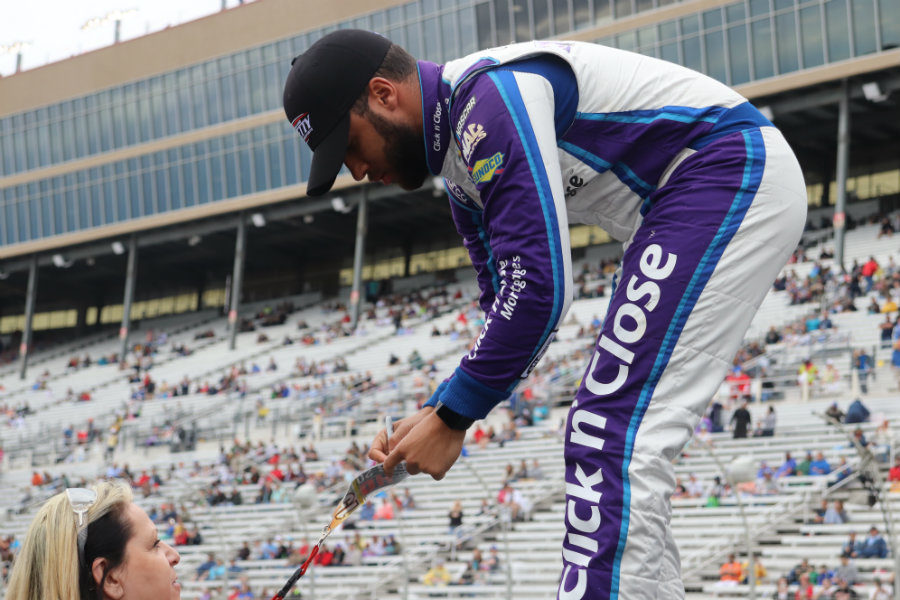 Feb. 25, 2018 - Darrell “Bubba” Wallace Jr. signs a fan’s lanyard at the driver’s introductions before the race begins. Wallace is the first African-American cup driver in the last 47 years. He finished 32nd after being involved in a wreck late in the race.