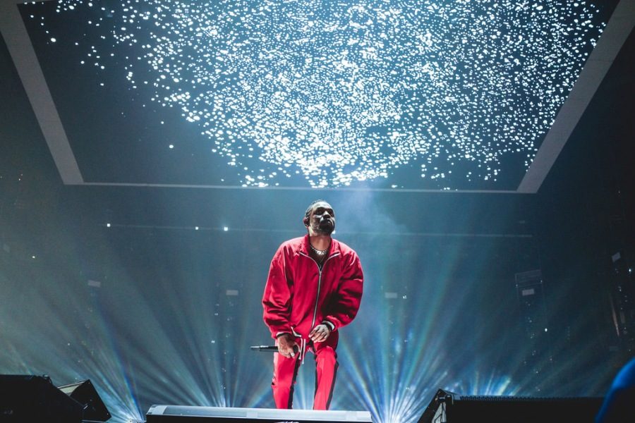 Kendrick Lamar looks at the crowd, mid performance. Lamar helped make the “Black Panther” soundtrack, which was released this February, a week before the movie was released. 