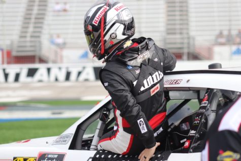 Justin Allgaier, driver of the No. 7 for JR Motorsports in the Xfinity Series, climbs into his race car for Saturday morning practice sessions at Atlanta Motor Speedway. Drivers are always thinking about what they can do during and after the race to stay safe and try to win. 