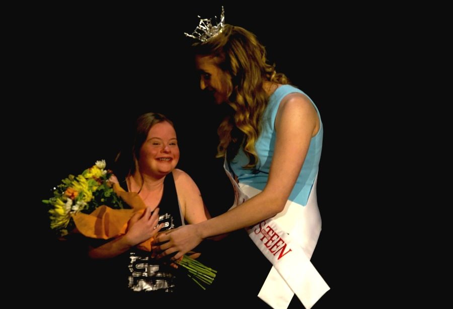 Spectators+of+the+PALS+pageant+voted+for+the+People%E2%80%99s+Choice+award%2C+and+Sarah+Dorr+presented+the+winner+with+a+bouquet+of+flowers+as+the+crowd+cheered+for+her.+With+the+silent+auction+and+people%E2%80%99s+choice%2C+PALS+raised+over+%241%2C800.