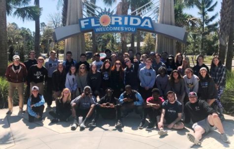 The Starr’s Mill track and field team poses for a picture in front of a sign in Florida. The boys and girls finished 8th and 14th, respectively, at the Kowboy Invitational in Kissimmee, Florida.