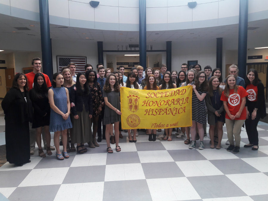 March 29, 2018 - Spanish Honor Society inductees pose with sponsor Madeline Rodriguez. A total of 50 students were inducted this year. To be eligible for Spanish Honor Society, students must have a 95% or higher in their Spanish classes for three consecutive semesters.