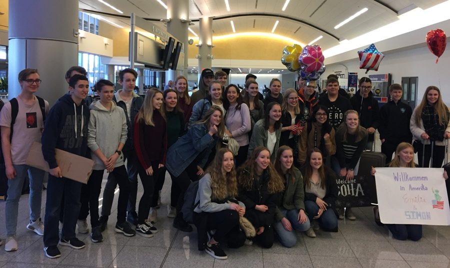 American partners welcome German exchange students at the airport. They stayed for three weeks, arriving on March 19 and returning home on April 11. 