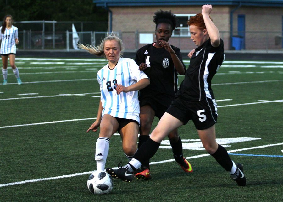 Lady Panther battles two Tigers for the ball. The Mill defeated Fayette County in a 6-0 shutout on April 19 with junior Meritt Parker and freshman Chloe Thompson leading Starr’s Mill with two goals apiece. 