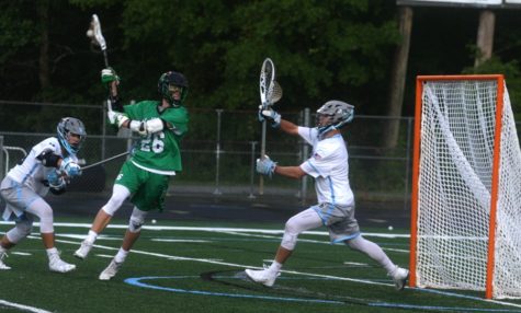 Sophomore Chief Brooks Baro shoots at junior Panther goalie Derek Saylor. Baro scored four goals against Starr’s Mill, but it wasn’t enough to overcome the Panther offense that averages over 17 goals per game.