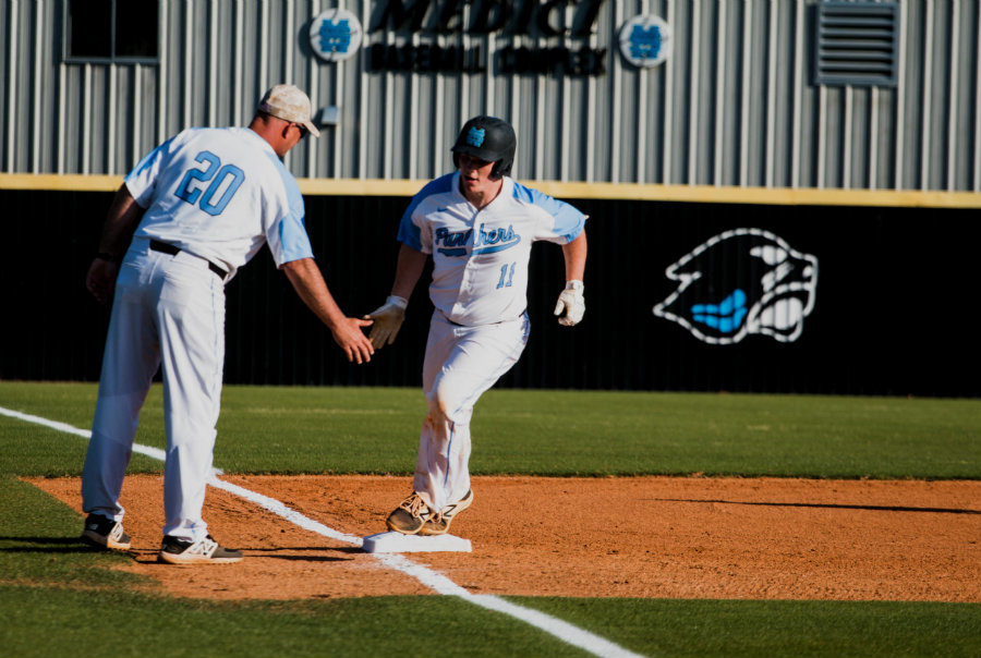 April 19, 2018 - Senior Charlie Mizell high fives head coach Brent Moseley after hitting a game-tying home run in the second inning. Mizell helped the Panthers defeat Harris County 8-7 in the team’s final game of the regular season.