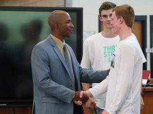 New boys’ basketball coach Charlemagne Gibbons meets juniors Nick Weist and Nate Allison during a conference with school staff, students, players, and parents. Gibbons joins the Starr’s Mill family after his previous tenure as an assistant coach at Florida Atlantic University.
