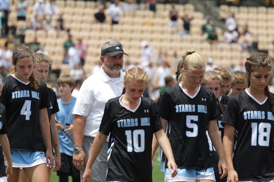 The Lady Panthers walk off the field following their 15-7 loss to Blessed Trinity. The Lady Titans won their third straight state championship by beating Starr’s Mill, who was playing in their first ever championship game.