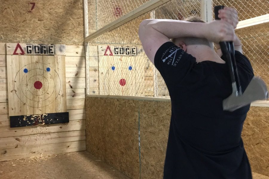 Zack Fair, owner of Agoge, prepares to throw two axes at once. Agoge is a new business that opened on May 5 in the Braelinn Village in Peachtree City. The business specializes in throwing various weapons for fun, competition, and as an alternative form of exercise. 