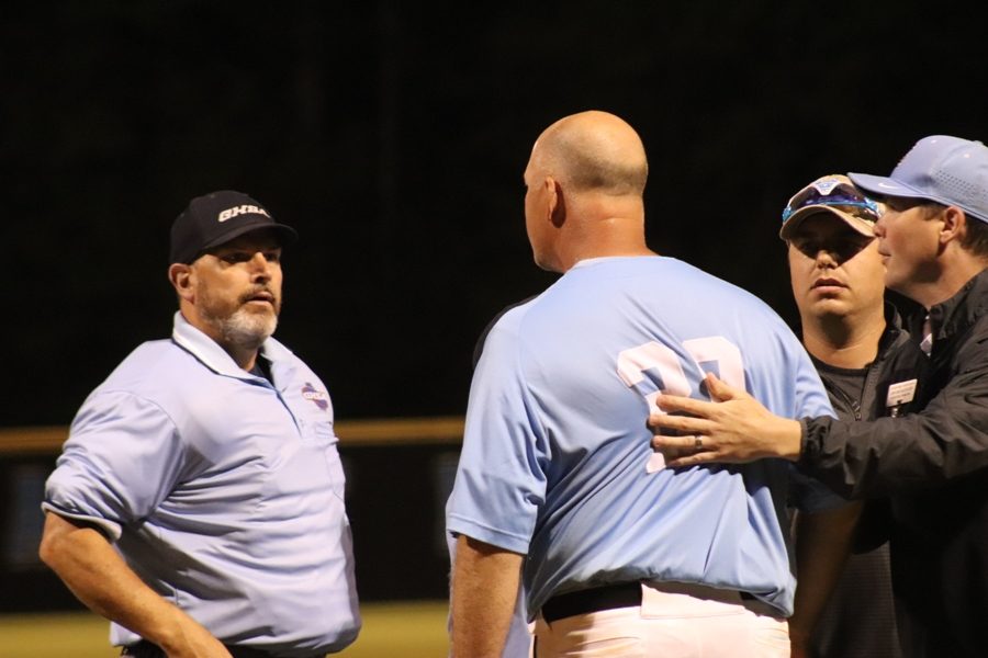 Head coach Brent Moseley argues with an umpire over a call. The Panthers lost game two after a questionable called third strike that gave Union Grove a narrow 6-5 victory and set up a series-clinching game three.