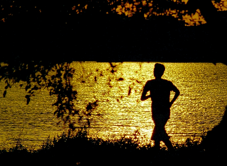Man goes on an evening jog. While most individuals run to gain physical strength, running on a regular basis can also improve our mental health and teach us the value of hard work.