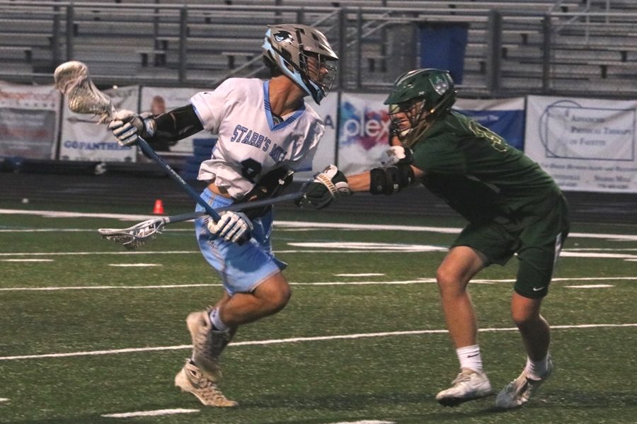 Titan defender checks a Panther Player. The Titans physical defense wore down the high powered Starr’s Mill offense. Despite averaging 17 goals per game, Blessed Trinity held the Panthers to a season-low six goals. 