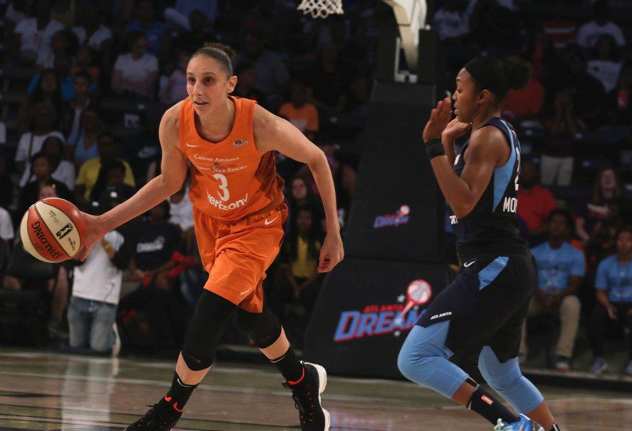 Atlanta guard Renee Montgomery avoids fouling Phoenix guard Diana Taurasi. Taurasi led the Mercury with 20 points, 8 assists in the team’s 78-71 win over the Dream.