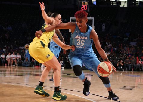 Forward Angel McCoughtry drives past Seattle Storm guard Sue Bird. McCoughtry was the second highest scorer of the night with 26 points for the Dream. Forward Breanna Stewart led all scorers with 29 points as the Storm defeated the Dream 95-86.  