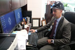 Starr’s Mill Principal Allen Leonard prepares himself for the 2018-19 school year. While on his computer he shows some of the schools new technology elements.