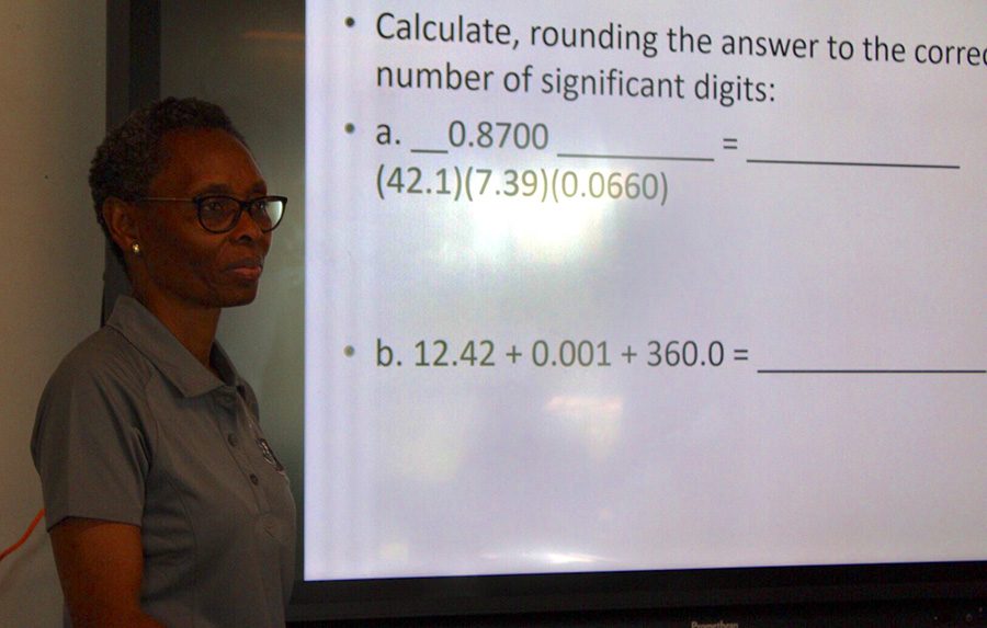 Toyin Mafe teaches her chemistry class about significant figures. Mafe joins the Starr’s Mill staff after previously teaching at Riverdale High School. 