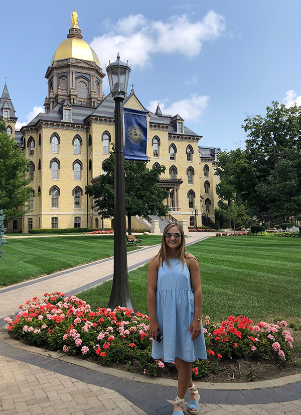 Elena Wernecke stands in front of Notre Dame after earning $107,750 in scholarships. Her newest scholarship earned her an additional $2,000 for her proficiency in Spanish. She plans to major in biology and Spanish.