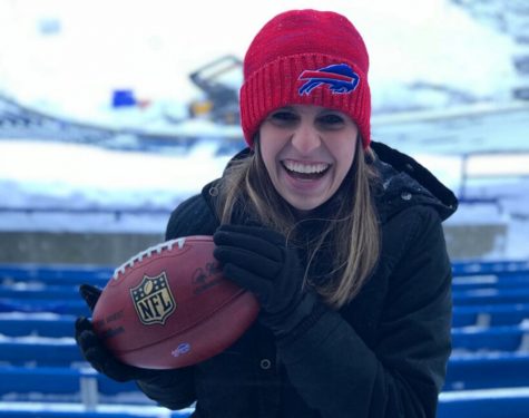 Former Panther Nicole (Chrzanowski)Hendricks stands inside New Era Field, the home of the Buffalo Bills. Hendricks grew up rooting for the Bills and is now the communications director for the team.