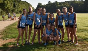 Varsity girls’ cross county team poses for a picture after the Providence Invitational. The varsity boys and girls finished third overall, and the JV boys finished fifth overall. 